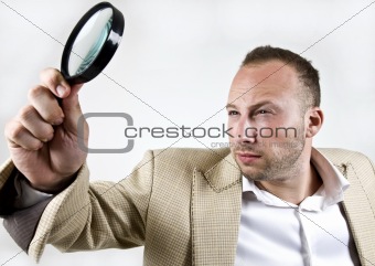 male with magnifying glass