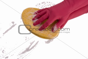 pink hand cleaning a mirror