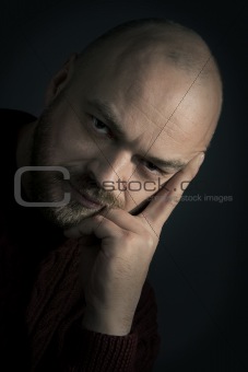 adult man portrait  on a dark background 