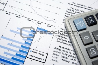 Calculator and printed financial report.