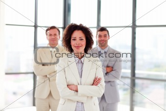 Portrait of a smiling businesswoman with folded arms