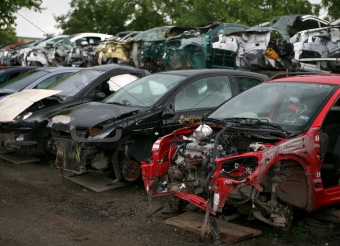Car cementary with many broken cars