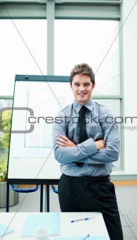 Young businessman explaining at the whiteboard