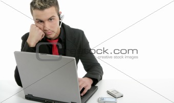 Young businessman with laptop and microphone