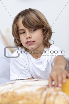 Little boy eating bread