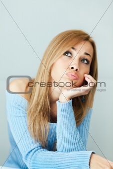 bored woman with hand on chin