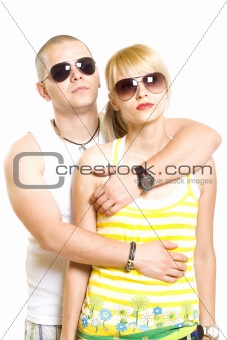 young trendy couple wearing sunglasses