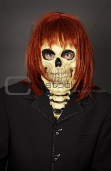 Funny man in mask a skull and wig