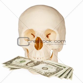 Skull devours money, isolated on white