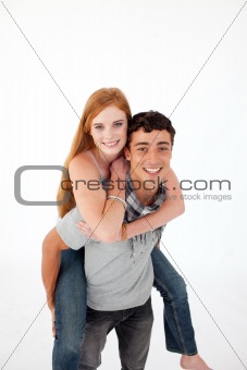 Teen giving his friend piggyback ride
