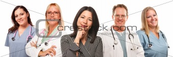 Beautiful Hispanic Woman with Male and Female Doctors or Nurses Isolated on a White Background.