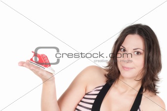 Portrait of pretty pregnant woman with baby shoes