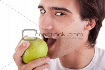 man eating a green apple, isolated on white background. Studio shot.