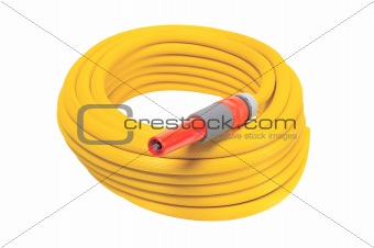 yellow garden hose coiled with spray nozzle