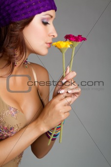 Woman Smelling Flowers