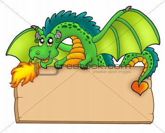 Giant green dragon holding board