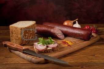 Composition with sausage on the table