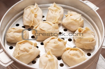 Kirghiz oriental dumplings on metal steam cooker