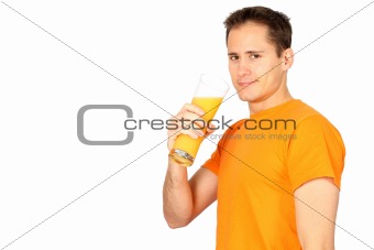 Handsome young man drinking orange juice with lots of copyspace