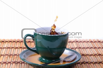 cup of green tea with splash