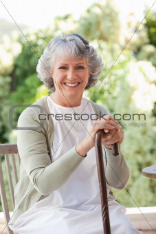 Retired woman with her walking stick
