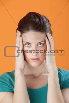 Woman Holding Head in Pain