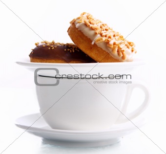 Tasty donuts and cup of coffee