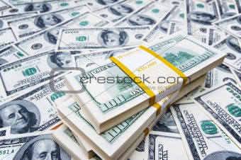 Stack of dollars on money background