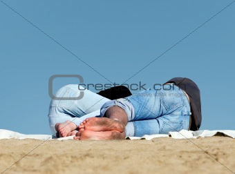 Couple sleeping on the beach