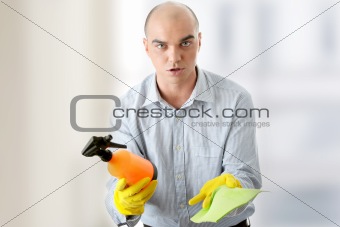 Businessman holding a cleaning accessories