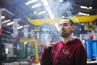 industry worker smoking cigarette