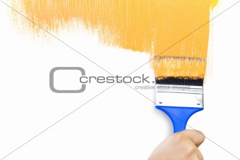 Orange  painted shape with brush / white background / copy space
