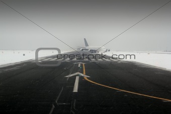 airplane wing aircraft landing in snow winter runway