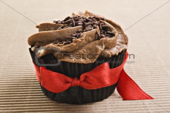 Chocolate cupcake with red bow