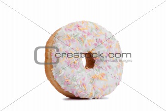 Pink Iced Doughnut covered in sprinkles isolated