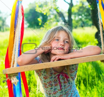 Young girl on swing