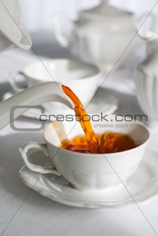 Pouring fresh tea.