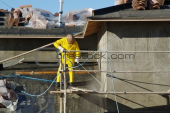 Construction Worker Pressure Washes