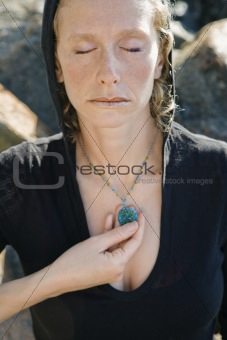 Woman with pendant.
