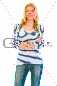 Smiling beautiful teen girl with crossed arms on chest 
