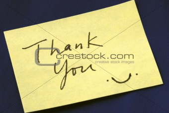 A Thank You note isolated on dark blue background