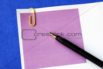 A purple sticky note isolated on blue