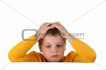 Small sad and hopeless boy holds head with hands resting arms on blank whiteboard isolated on white