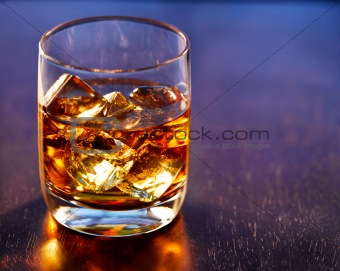 Highball glass of alcohol with ice