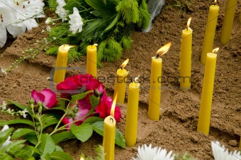Candles on the grave.