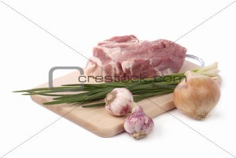 raw meat with onion and garlic isolated on white