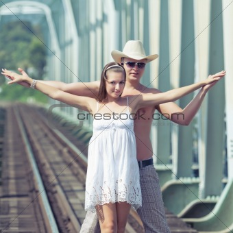 Couple on train tracks