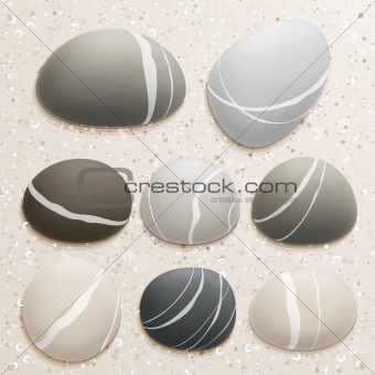 Sea stones collection on sand background