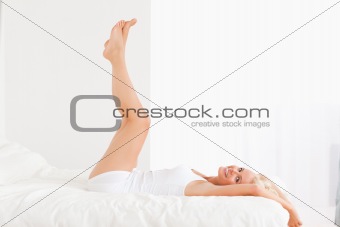 Smiling woman with the legs up