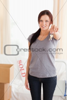 Portrait of a Cute woman holding keys